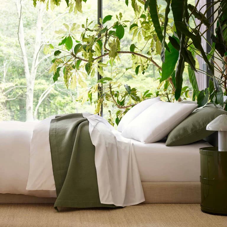 Brooklinen bedding styled on a bed